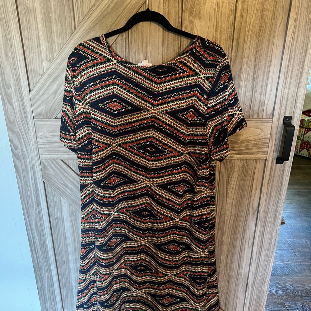 New w/o tags dress by LuLaRoe. High/low hem line and size 3X. Pocket on front